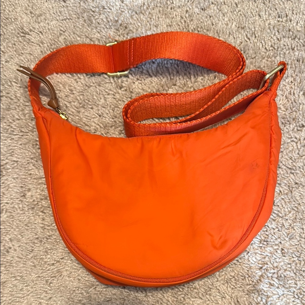 Vibrant Orange Crescent Shoulder Bag with Wide Strap